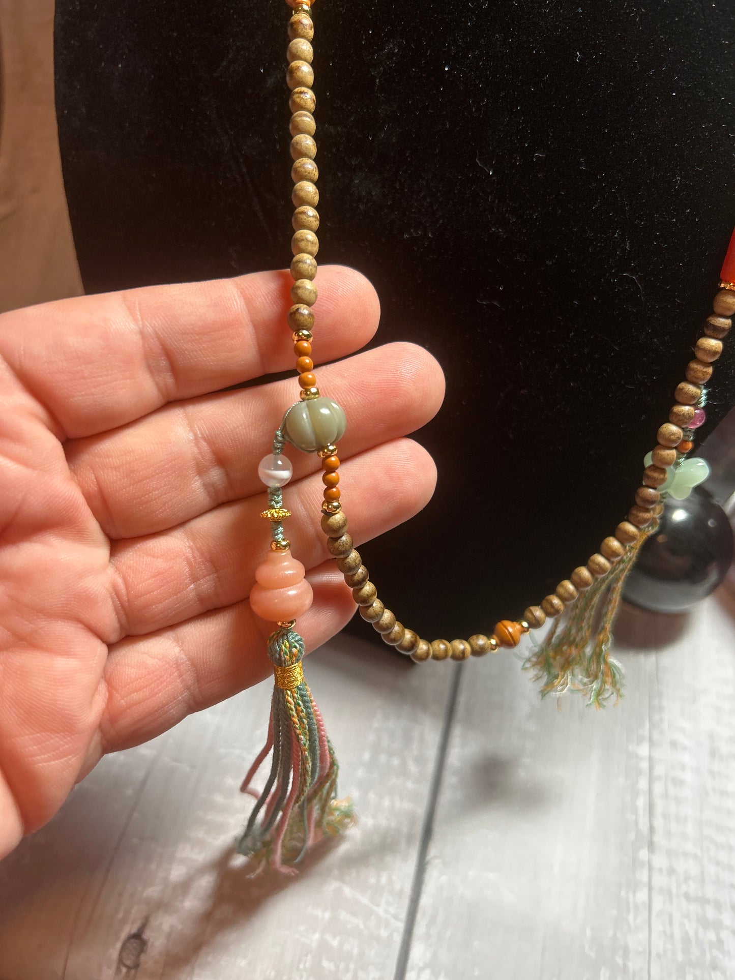 Two tassel wooden bead crystal mix necklace